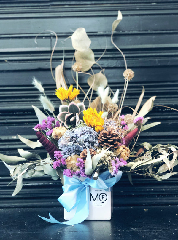 dried flower arrangement yellow and blue 