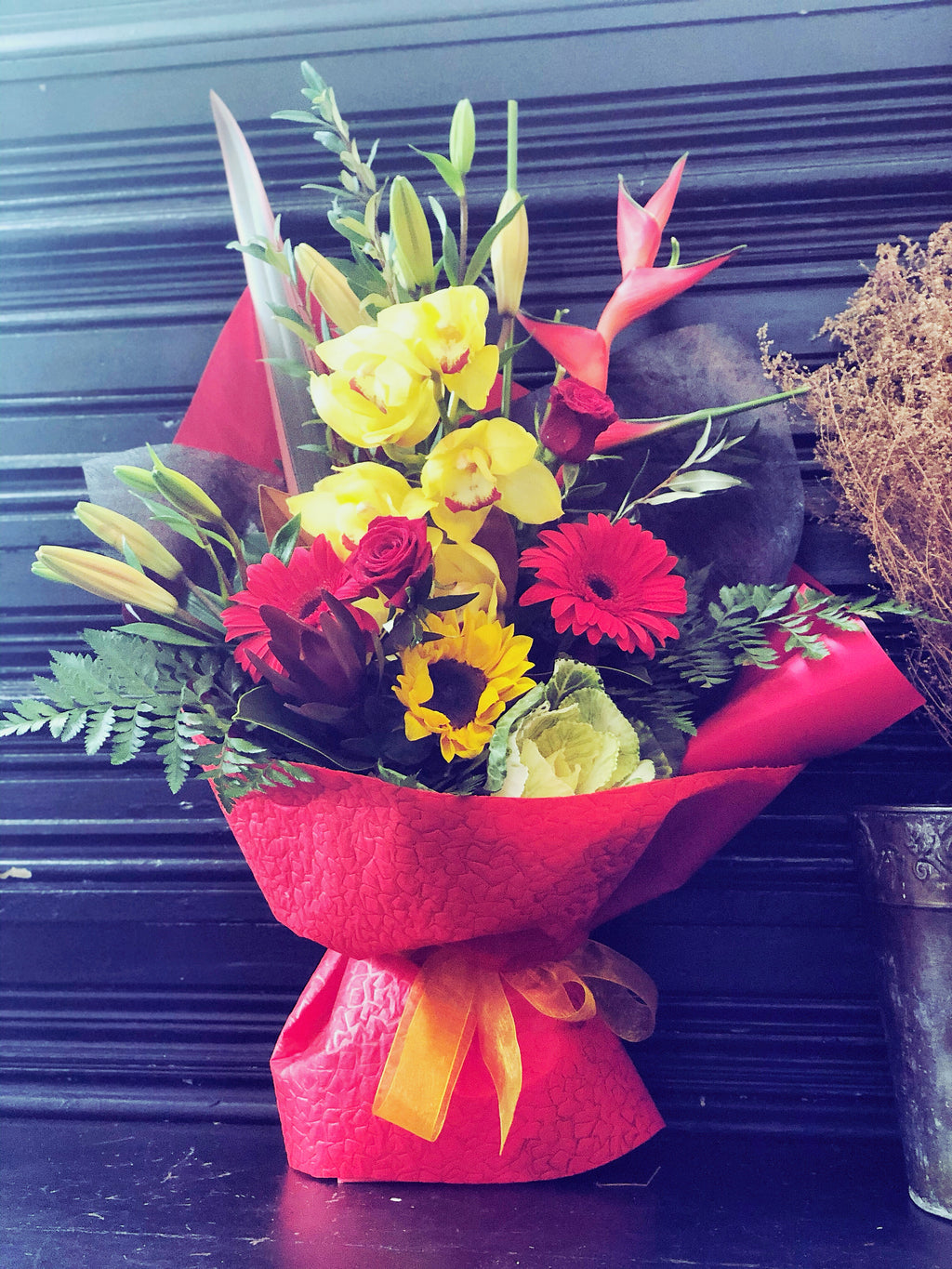 Red Fresh Flowers arrangement in container