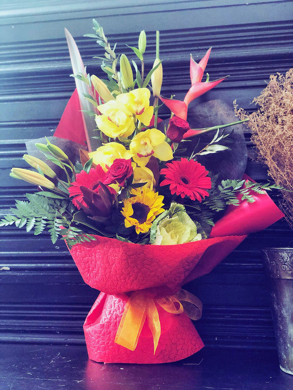 Red Fresh Flowers arrangement in container