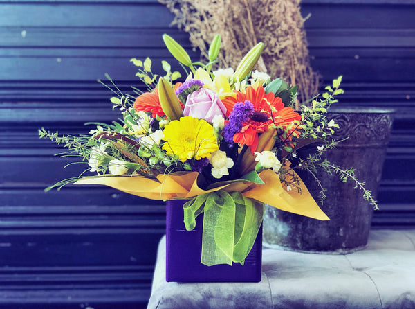 Fresh Flowers Arrangement in Container Colourful