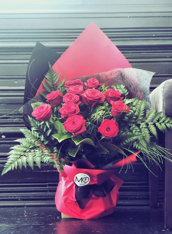 fresh red roses in container valentine's day flowers