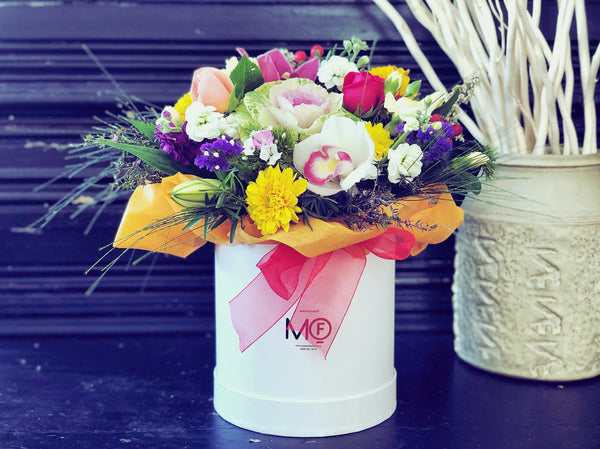 Fresh Flowers Arrangement in Container Colourful