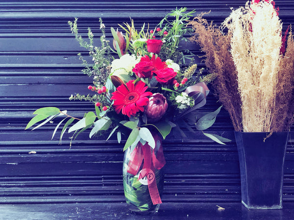 Red Fresh Flowers Arrangement in Glass Vase